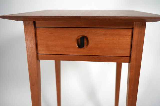 Side table made from cherry with ebony handle