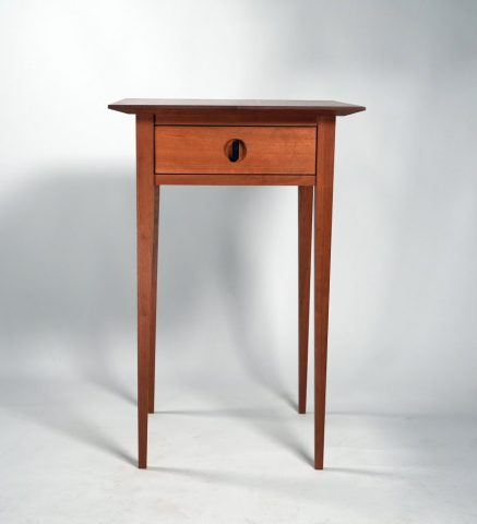 Side table made from cherry with ebony handle