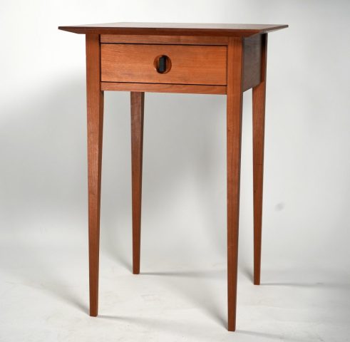 Side table made from cherry with ebony handle